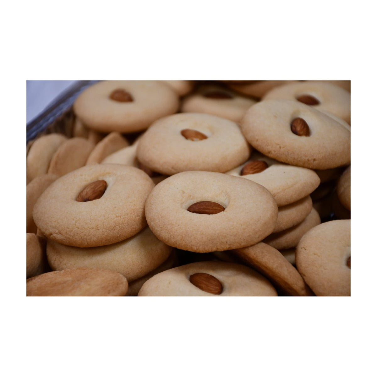 Amber almond cookies in a clear bakery package