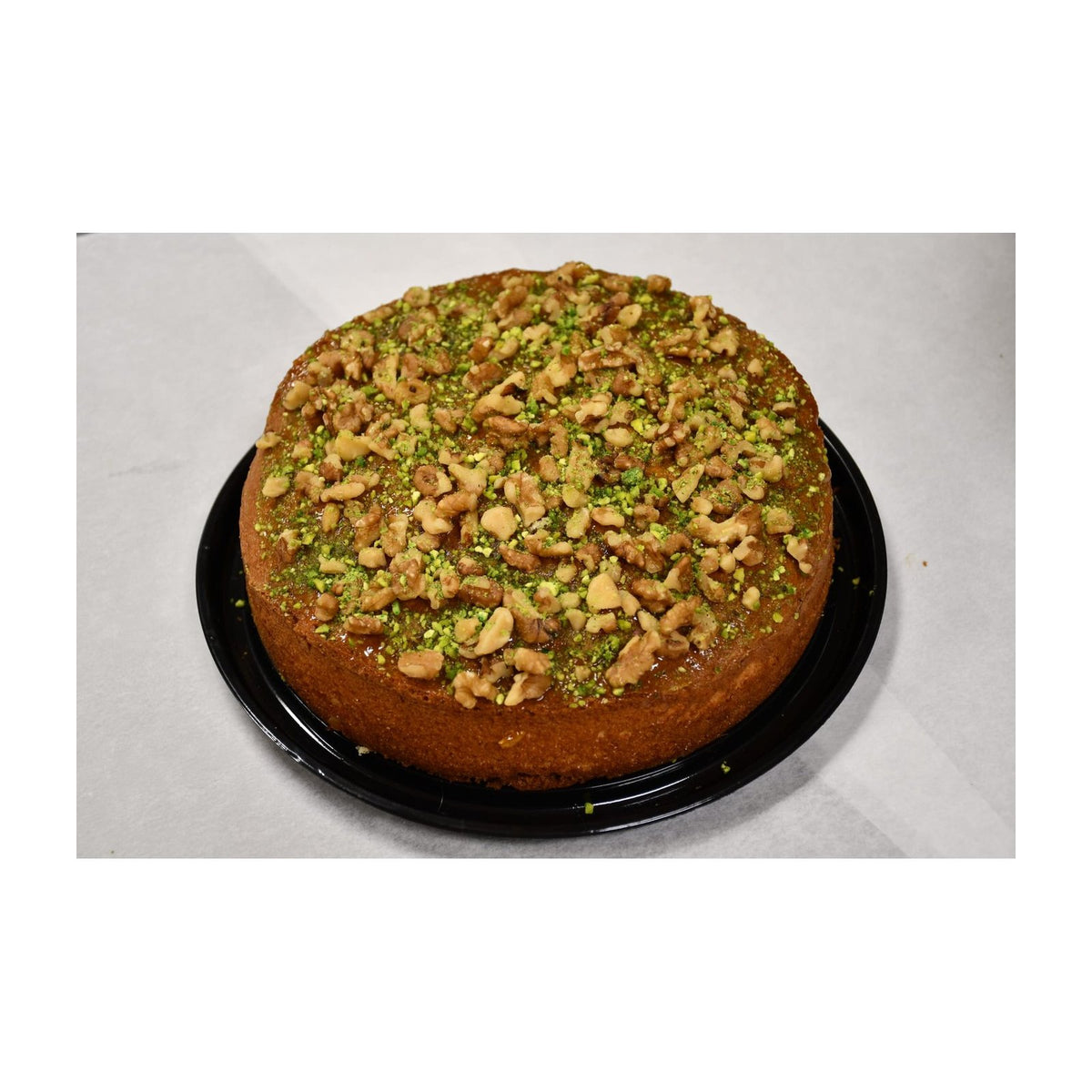Amber round walnut cake in its package